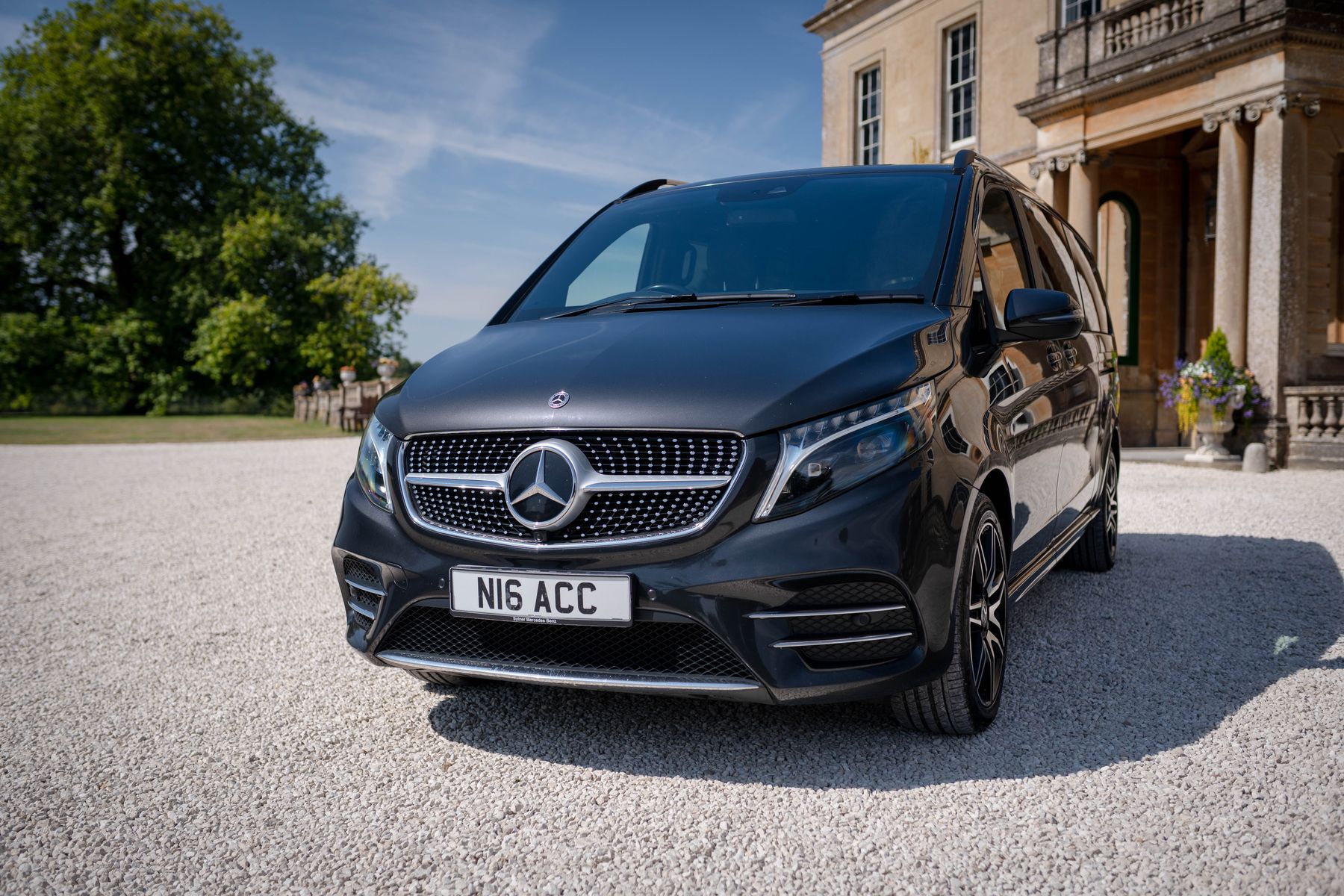 Black Mercedes V-Class on the gravel in front of a Georgian portico